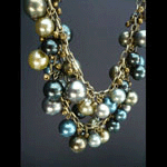 Shell pearls with brass colored beads necklace